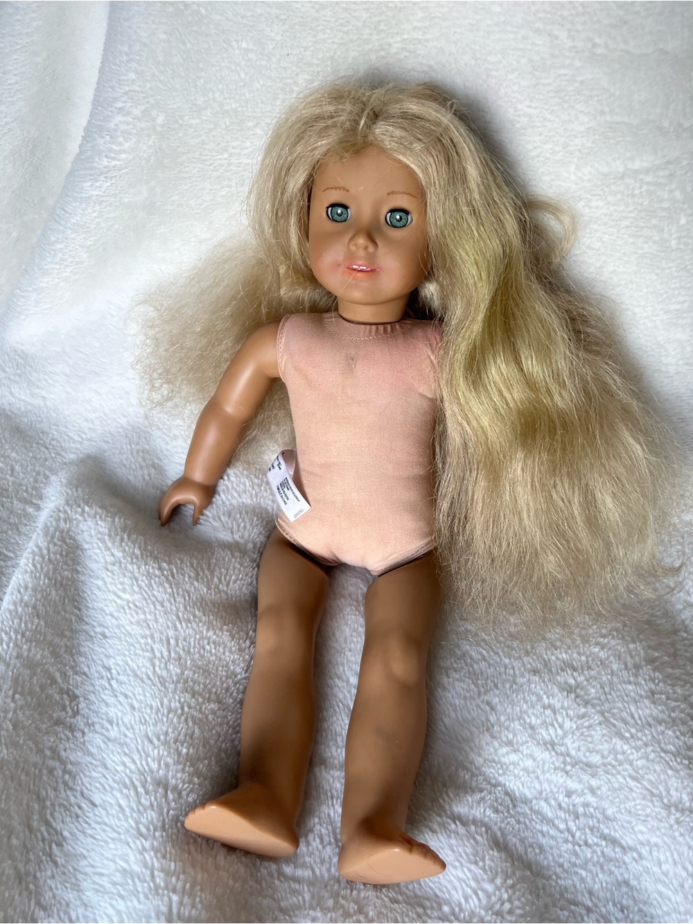 American Girl Blonde Doll with Pink Bodysuit and Blue Eyes